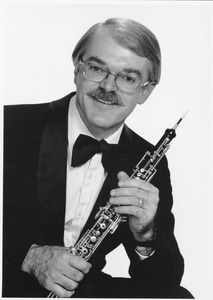 Charles J. Lehrer, holding oboe