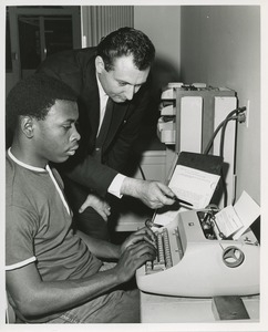 An instructor and trainee at TOWER clerical training