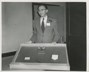 Unidentified man displaying office supplies