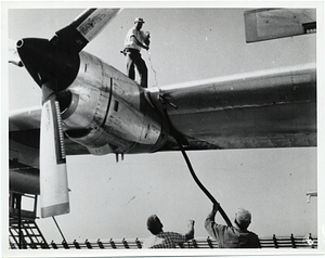 Unidentified men performing maintenance on a U.S. Air Force aircraft