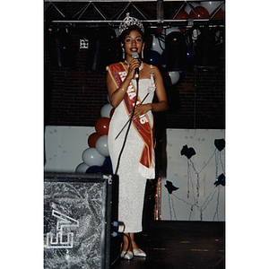 The queen of the 1995 Puerto Rican Festival speaks into a microphone