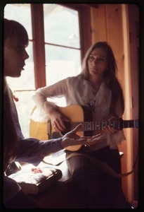 Judy Collins (with guitar) and Joni Mitchell and Mitchell's house in Laurel Canyon