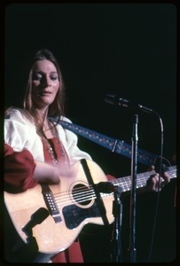 Judy Collins: with guitar, performing on stage
