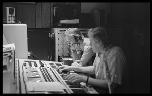 Stephen Stills and Bill Halverson (sound engineer) working at the mixing board in Wally Heider Studio 3 while producing the first Crosby, Stills, and Nash album