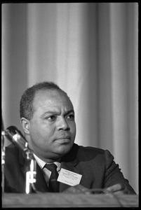 James Farmer, seated as part of a panel at the Youth, Non-Violence, and Social Change conference, Howard University