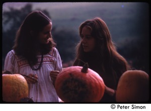June Arons and Lacey Mason with three pumpkins, Tree Frog Farm commune