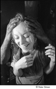 Karmu (Edgar Warner) massaging a patient's head