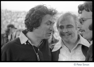 Bill Graham (left) talking to Marlon Brando and unidentified man