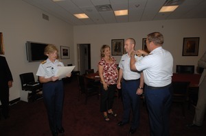 Commander Mark Fedor (center), US Coast Guard, being sworn in as Special Detailee to House Appropriations Committee