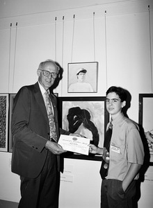 Congressman John W. Olver (center) presenting an award for creative merit to Noah Sparkes