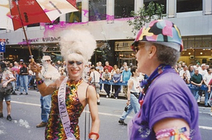 A Photograph of Stormé DeLarverie in a Multicolored Hard Hat and Purple Shirt