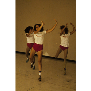 Women doing dance moves in a gym