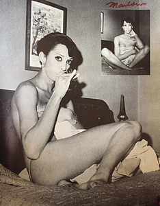 A Photograph of Marlow Monique Dickson Posing on a Bed