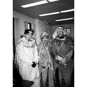 Three men dressed as the Three Kings, or Magi, pose for a group portrait in the Inquilinos Boricuas en Acción offices.