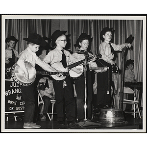 Bunker Hillbillies (left to right) Kevin Keane, Curtis Weikel, Tom Campbell, Edward Gould, and Jim Connolly play their instruments on stage