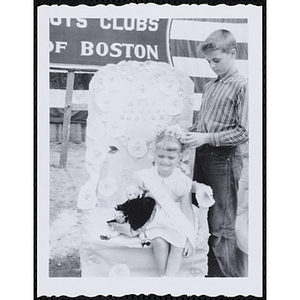 John Connolly places a crown on his sister Maryann, Miss South Boston of 1959, at the Boys' Club Little Sister Contest