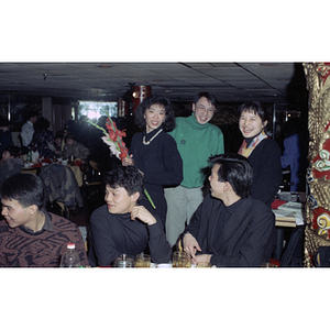 Men and women smile at a Chinese Progressive Association celebration of the Chinese New Year