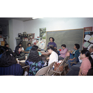 Chinese Progressive Association members listen to Suzanne Lee at a meeting