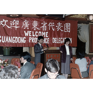 Man addresses a group gathered at Imperial Tea House restaurant in Boston's Chinatown for a welcome dinner for the Guangdong Province delegation
