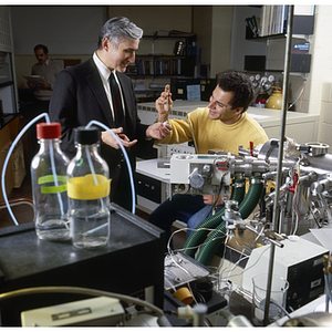 Paul Vouros, professor of chemistry, conducting an experiment with a student in a laboratory