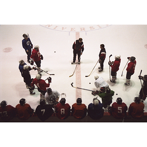 Hockey players and their coach during a practice