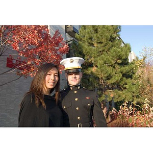 A man in uniform poses with a woman at the Veterans Memorial dedication ceremony