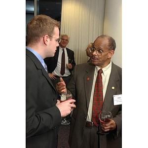 Two guests converse at The National Council Dinner