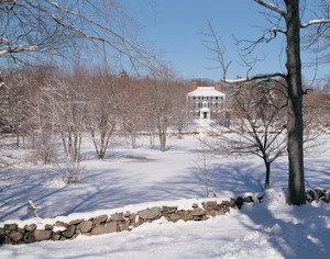View of the exterior in snow from a distance, Codman House, Lincoln, Mass.