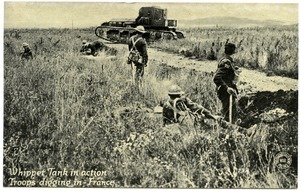 Whippet tank in action, troops digging in, France