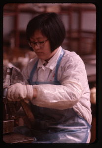 Woman working at machine