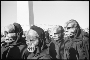 Performers from Bread and Puppet Theater wearing death's masks facing the crowd (close-up): Washington Vietnam March for Peace