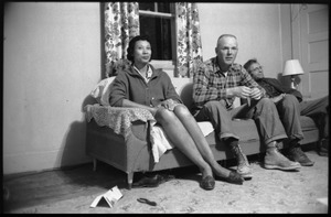 Mildred and Richard Loving (from left) seated on a couch with Richard's father