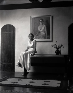 Mrs. Carl Miller (?) posed in front of her portrait