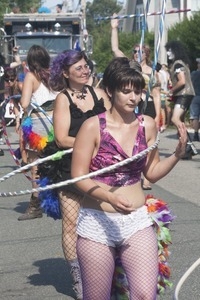 Parade marchers wielding hula hoops : Provincetown Carnival parade