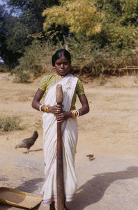 Young Munda woman pounding grain