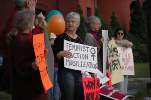 Protest against a pornographic video store in Northampton: protesters with signs reading 'Feminist Action Mobilization' and 'No porn here or anywhere'