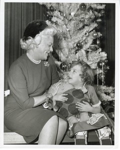 Margaret Milbank Bogert with young girl and doll at Christmas