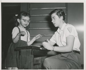 Physical therapist with young girl