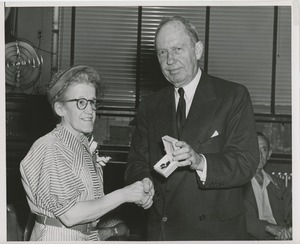 Jeremiah Milbank awarding woman