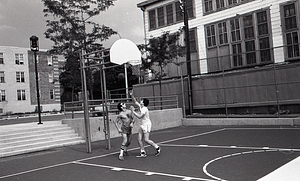 Teenagers playing basketball at Lo Presti Park