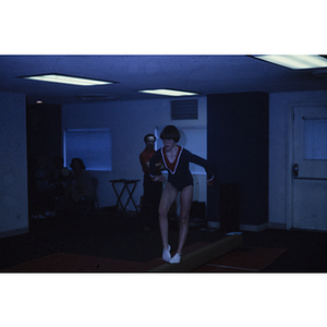 Gymnast practicing on a balance beam