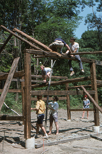 Setting rafters (1) at southern end of barn at the Moon Barn Raising at entrance to Hopkins Forest on 2 August 1975.