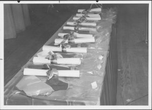 Diplomas displayed on table at the 1961 Suffolk University commencement