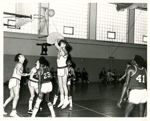 Suffolk University men's basketball player Dave Helberg (54) scores his 1000th point, 1969