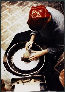 View of person crafting item at pottery wheel