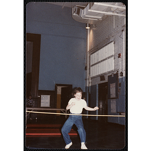 A girl stands in front of a rope at the Charlestown gymnasium