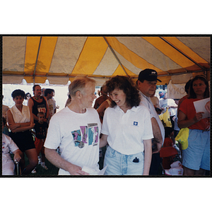 A runner and woman pose for a shot during the Bunker Hill Road Race