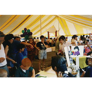 People and activities inside a tent at the Recreation Day fair