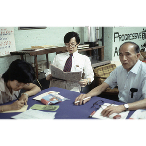 Suzanne Lee and You King Yee sit with another member of the Chinese Progressive Association at the organization's office