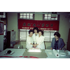 Guests and cake at an International Workers' Day event